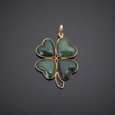 a gold and jade four leaf clover pendant