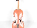 an old violin sitting on a white surface with a white background