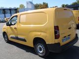 a yellow van that is parked in a parking lot