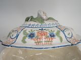 a large bowl with a lid on a table