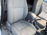 a white van with two seats in the back of it