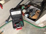 a box full of assorted items sitting on the ground