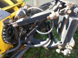 a close up of a motorcycle that is parked in the grass