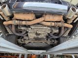 a car that is under the hood of a truck