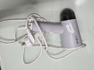 a hair dryer that is sitting on top of a counter
