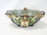 a bowl with a design on it on a white surface