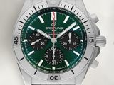un gros plan d'une montre au cadran vert