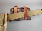 a belt that is attached to the back of a bag