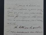 une vieille lettre écrite à la main sur un morceau de papier avec une écriture dessus