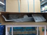 a cardboard box on top of a carton filled with plastic containers