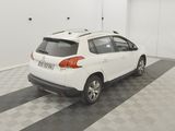 a picture of a white car parked in a garage