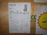 a sign on the door of a building that says vap 24