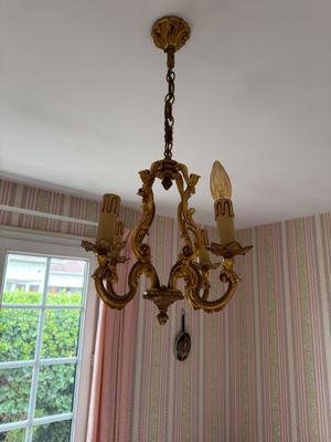 a chandelier hanging from the ceiling in a room
