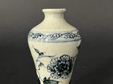 a small vase that is sitting on a table