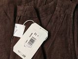 brown cordurope pants with a price tag on the back of them