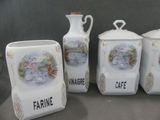 three white ceramic containers sitting next to each other on a table