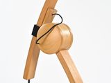 a close up of a wooden object on a white surface