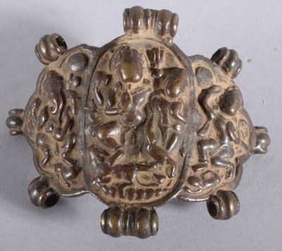 a silver brooch with a picture of a man and a woman on it