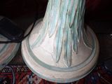 two vases that are sitting on a rug