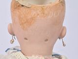a small doll that is sitting on a table