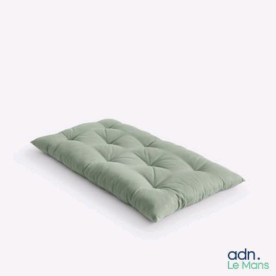 une image représentant un matelas futon vert sur fond blanc