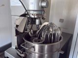 a mixer that is sitting on a counter in a kitchen