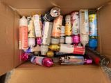 a cardboard box filled with many different types of beauty products