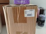 a box of soap sitting on a table next to a box of soap