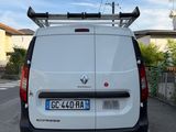 a white van that is parked on the side of the road