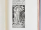 an open book with a picture of a nude woman on it