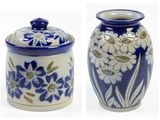 two blue and white vases with flowers on them