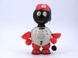 a toy figure of a man with a red hat and a black and white shirt