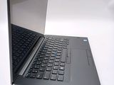 a laptop computer sitting on a table with a keyboard