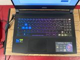a laptop that is sitting on a table with a mouse