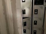 two lockers in the corner of a room that is being remodeled