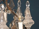a chandelier that has a candle and a star on it