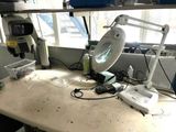 an image of a desk with a lamp on it