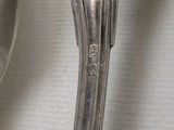a spoon and a spoon rest on a table