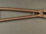 a close up of a pair of pliers on a table