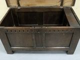 a wooden chest with a metal latch on it