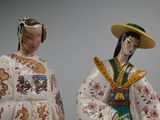 pair of asian figurines of a woman and a man