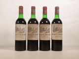 trois bouteilles de vin sont alignées sur une table
