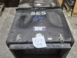 two black boxes sitting on the floor next to each other