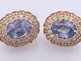 a pair of tanzanite and diamond earrings