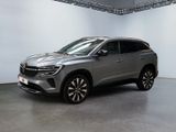 un SUV argenté garé dans un garage aux murs blancs