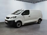 the white van is parked in a large room with white walls