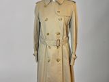 an image of a beige trench coat on a mannequin mannequin