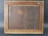 an old wooden picture frame with a small hole in the middle of it