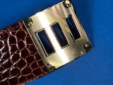 a close up of a brown alligator skin watch band