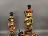 three figurines of a man with a hat and a top hat